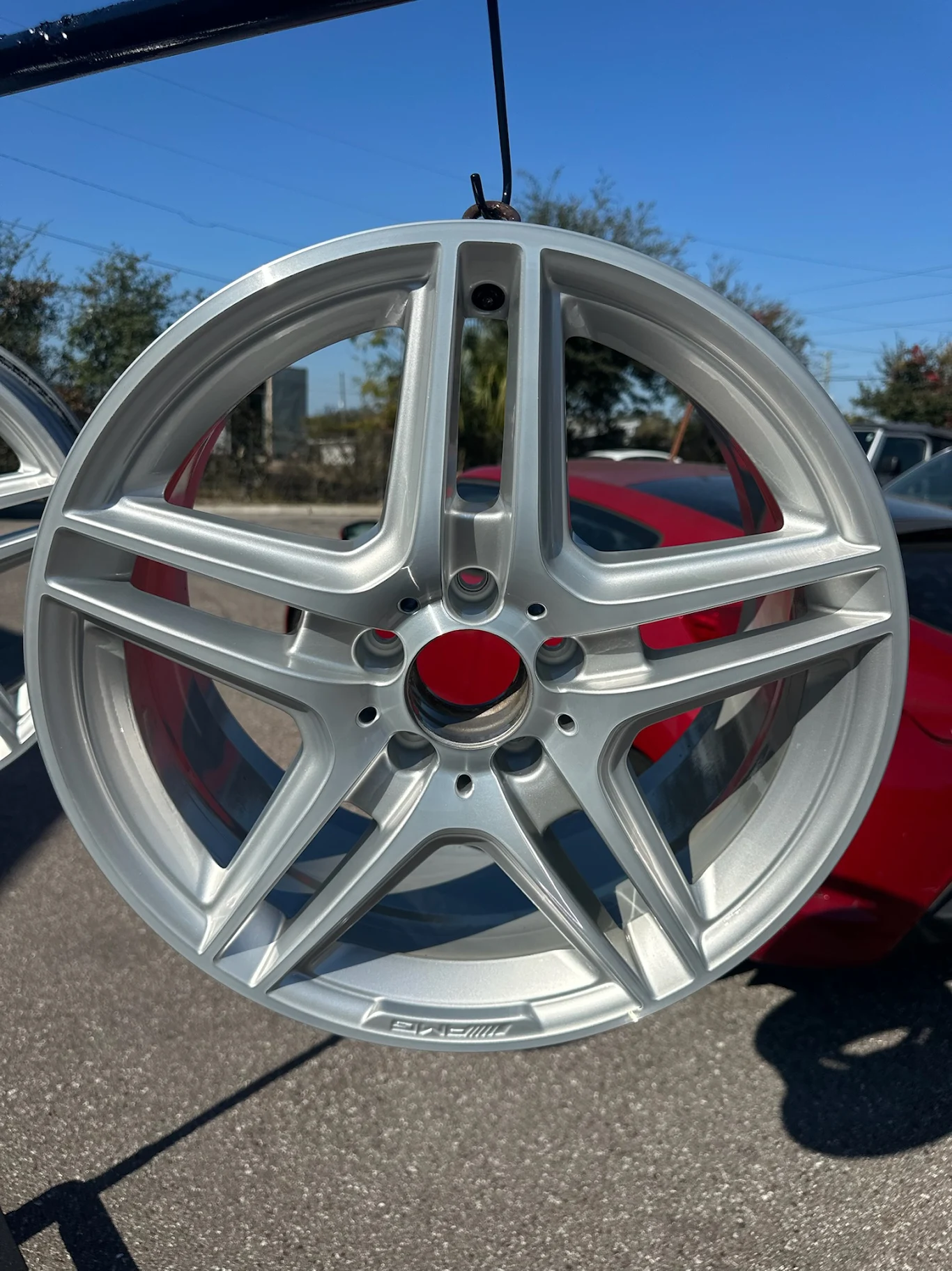 Mercedes AMG wheel refinished to a factory-grade silver finish